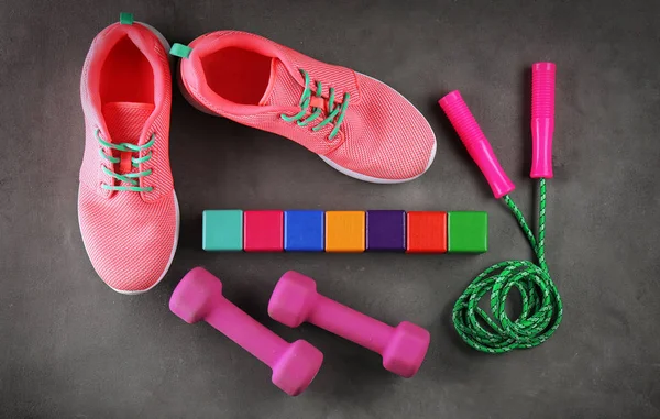 Sneakers, skipping rope and cubes — Stock Photo, Image