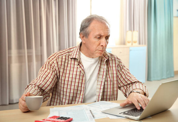 man calculating taxes