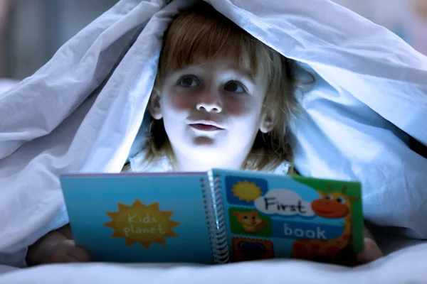 Cute Little Girl Reading Book Bed Blanket — Stock Photo, Image