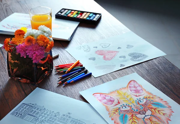 Coloring pictures for adults on table