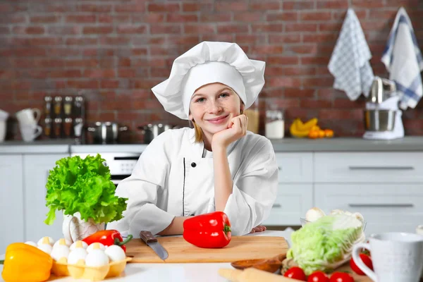 Cute girl cooking in kitchen — Stock Photo, Image