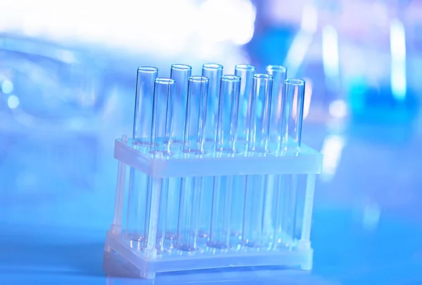 Test tubes on blurred background — Stock Photo, Image