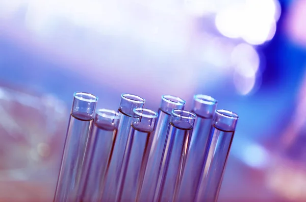 Test tubes on blurred background — Stock Photo, Image