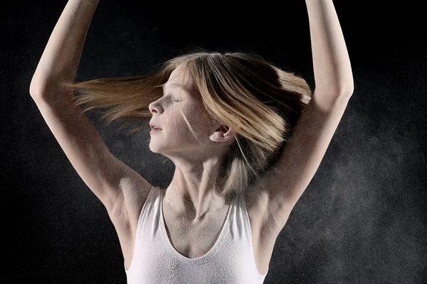 Little girl dancing with white powder — Stock Photo, Image