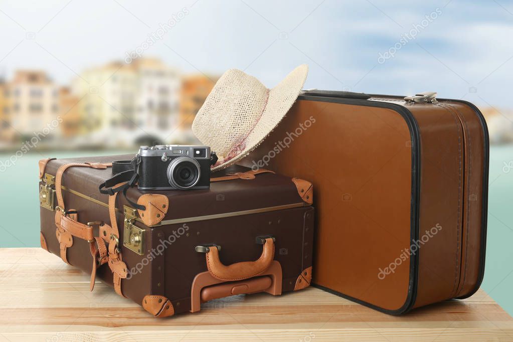 Suitcases on seascape background