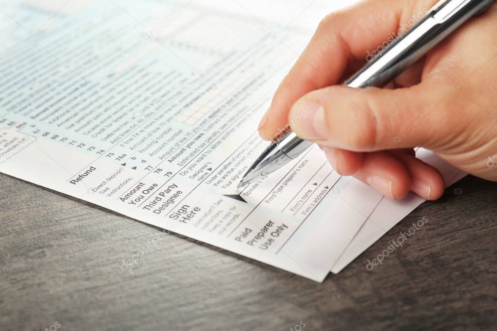 Woman filling tax return form