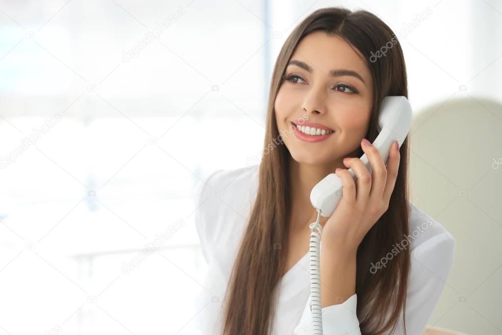 woman talking by telephone