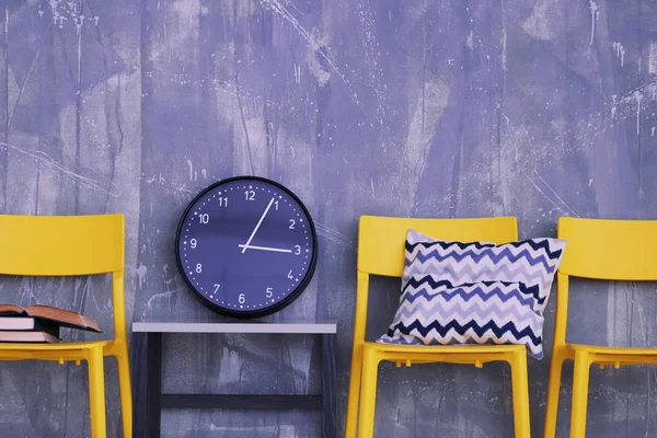 Modern chairs against blue wall — Stock Photo, Image