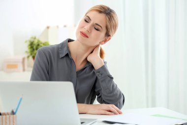 woman suffering from neck pain clipart