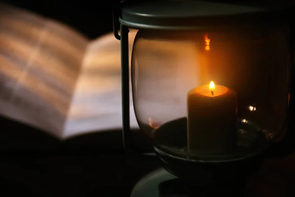 Burning candle and Bible — Stock Photo, Image