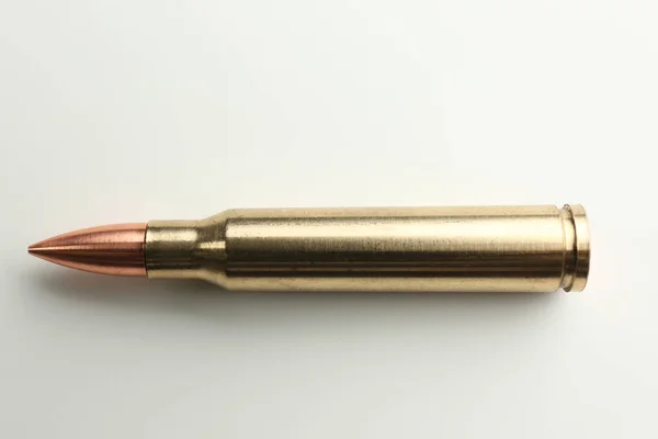 Rifle bullet on white — Stock Photo, Image