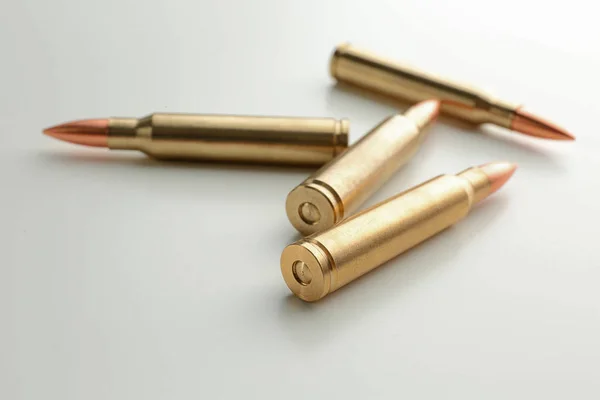 Rifle bullets on background — Stock Photo, Image