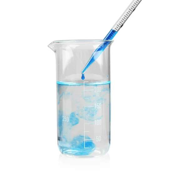 Beaker with color water and glass pipette — Stock Photo, Image