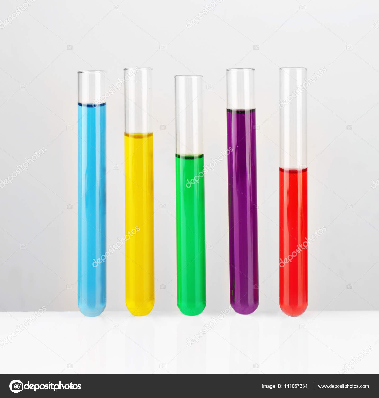 Test tubes with colourful samples — Stock Photo © belchonock 141067334