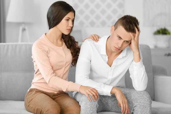 Depressed man with girlfriend — Stock Photo, Image