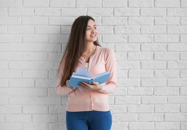 Young woman with book — Stock Photo, Image