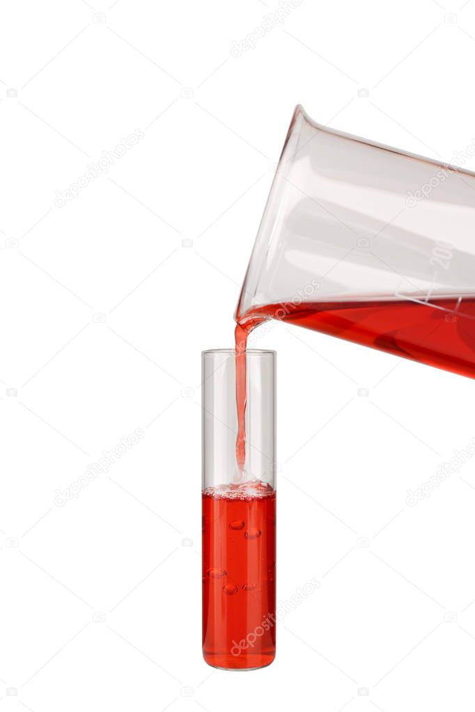 Pouring red sample into a test tube 