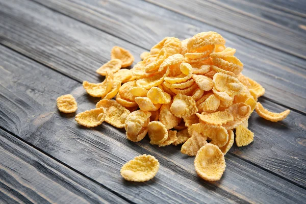 Cornflakes on grey wooden table — Stock Photo, Image