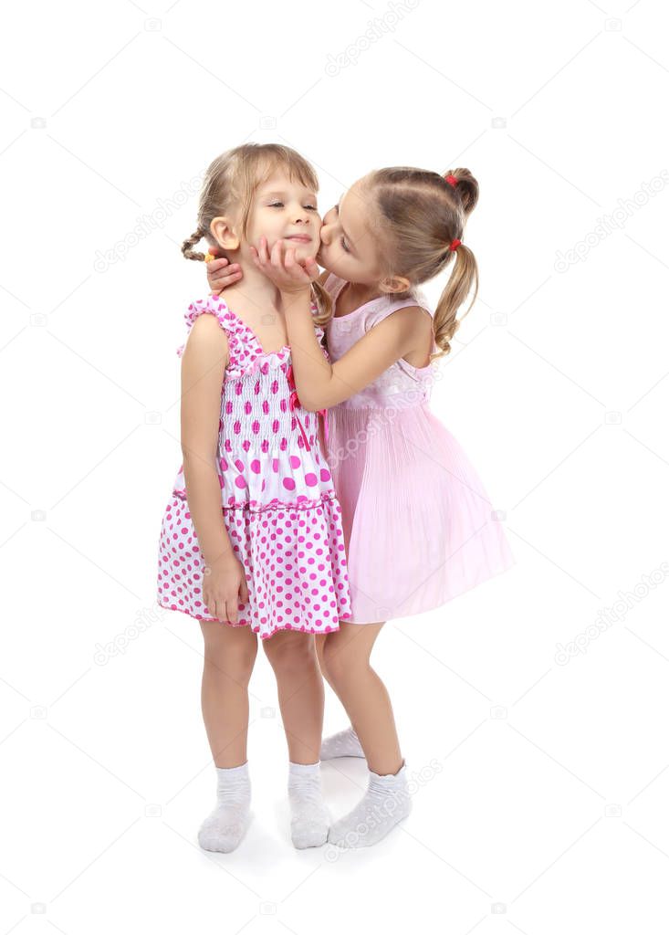 little sisters in beautiful dresses