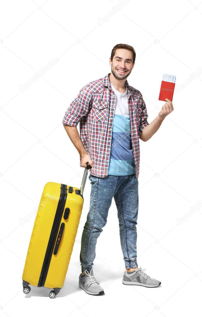 Male traveler with passport and ticket on white background