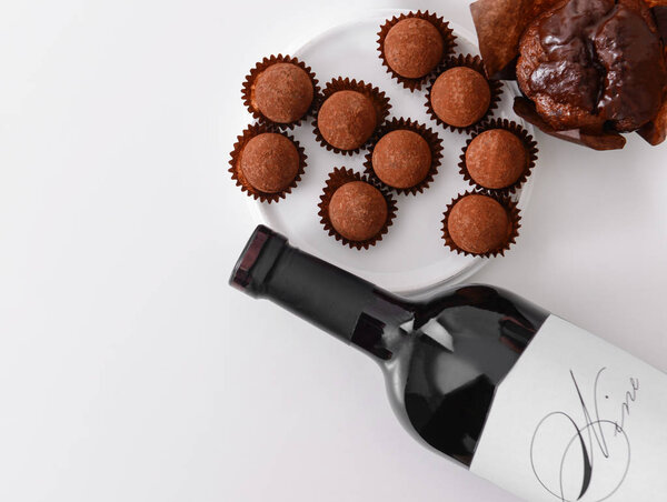 Delicious chocolate cake, truffles and red wine