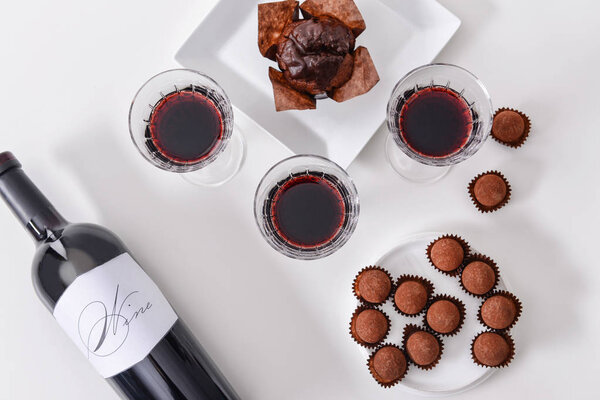Delicious chocolate cake, truffles and red wine