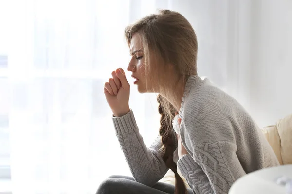 Ill woman sitting on armchair — Stock Photo, Image