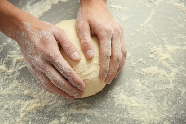 Male hands kneading dough — Stock Photo, Image