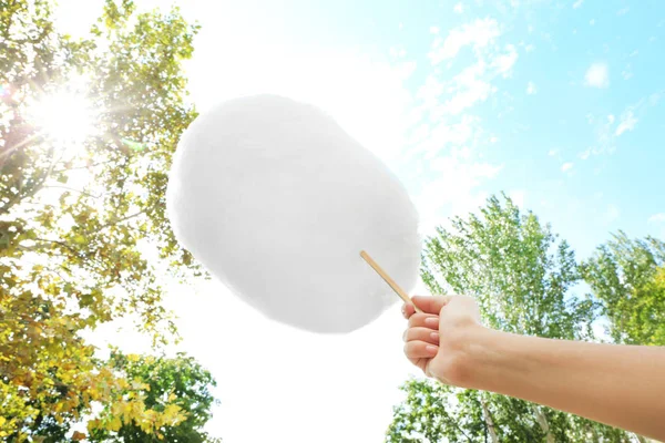 Female hand holding cotton candy — Stock Photo, Image