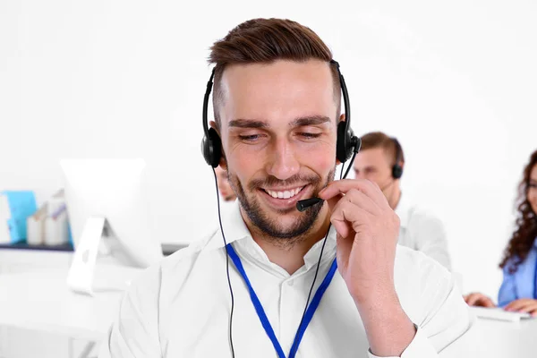 Young male technical support dispatcher working in office, closeup — Stock Photo, Image