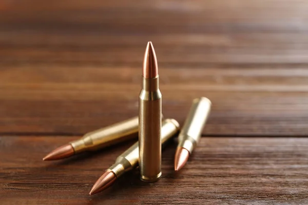 Bullets on wooden background — Stock Photo, Image