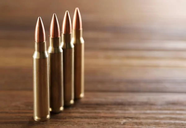 Bullets on wooden background — Stock Photo, Image
