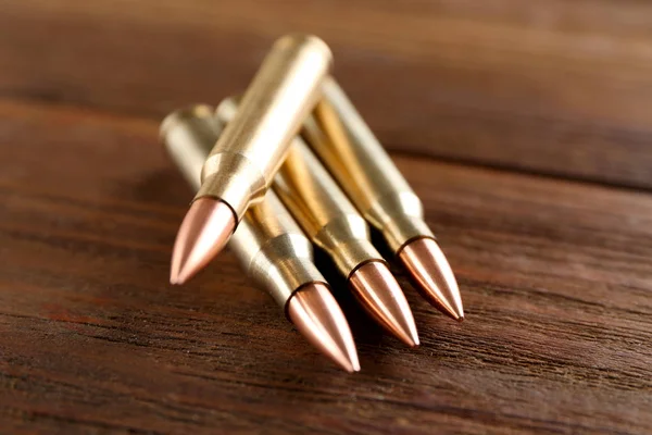 Bullets on wooden background — Stock Photo, Image