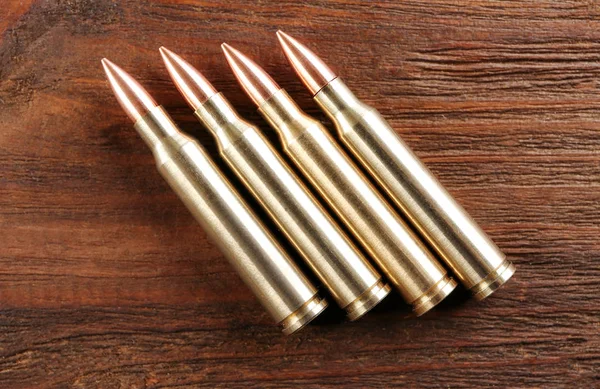 Bullets on wooden background — Stock Photo, Image