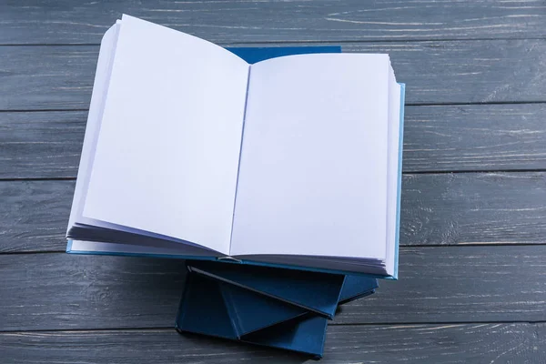 Opened book on grey wooden background — Stock Photo, Image