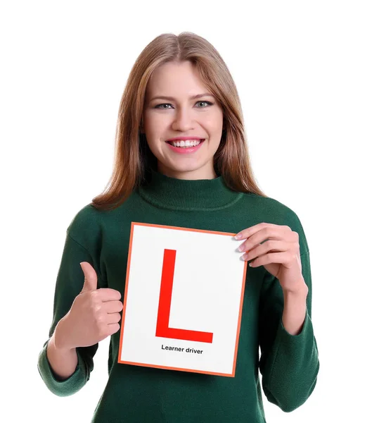 Junge Frau mit Fahrschüler-Schild auf weißem Hintergrund — Stockfoto