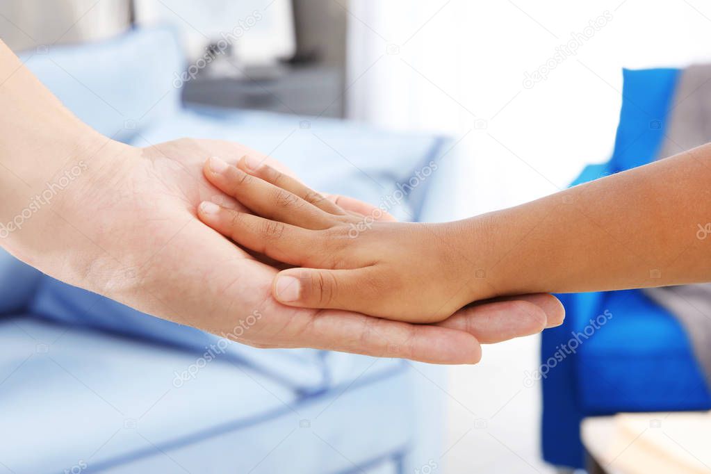 Hands of African American girl and man. Family concept
