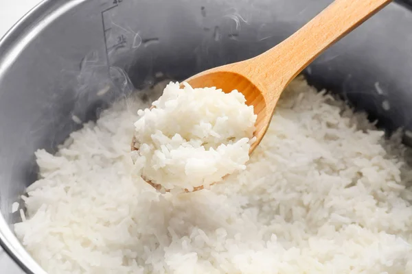 Mixing rice in metal pan, closeup — Stock Photo, Image