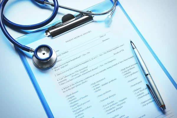 Stethoscope and patient medical history — Stock Photo, Image