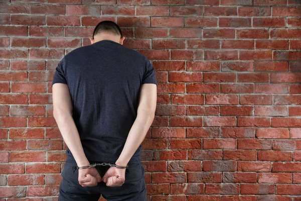 Man hands in handcuffs — Stock Photo, Image