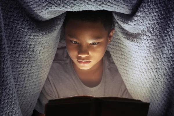 Cute Boy Reading Book Night — Stock Photo, Image