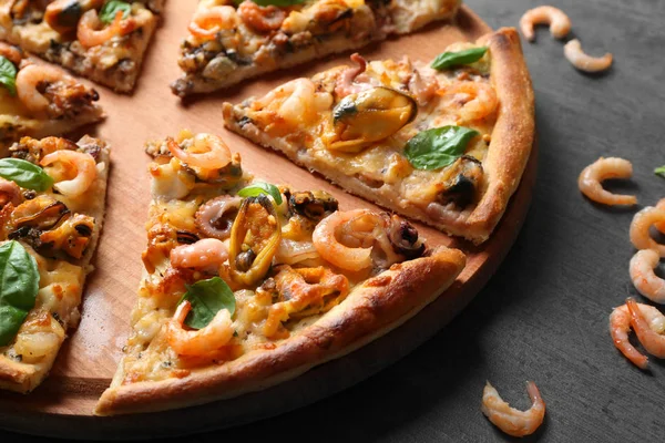 Tasty sliced pizza with seafood — Stock Photo, Image
