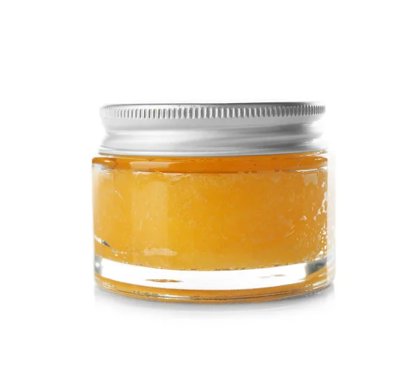 Glass jar with orange scrub — Stock Photo, Image