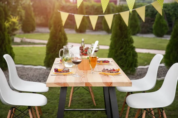 Table with food and drinks — Stock Photo, Image