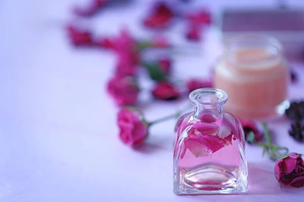 Aroma oil with flowers — Stock Photo, Image