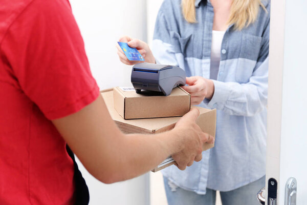 woman paying for package 