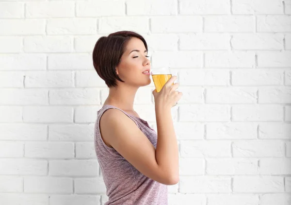 Young beautiful woman with glass of juice — Stock Photo, Image
