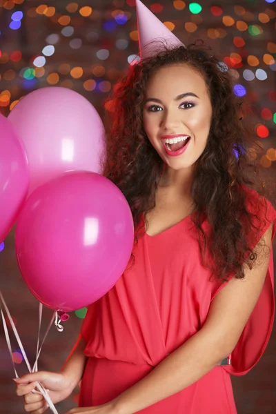Beautiful African American woman with balloons — Stock Photo, Image