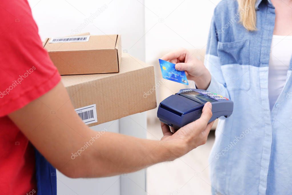 woman paying for package 