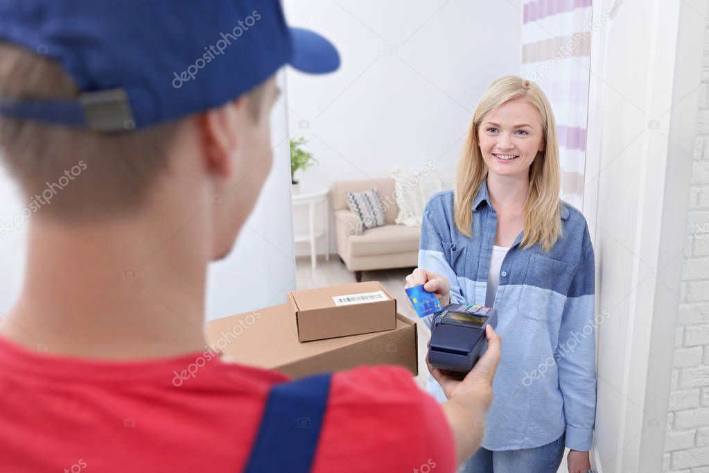 woman paying for package 